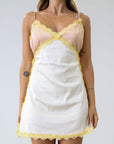 Satin dress. Lace trim. Adjustable straps. Back hook and eye and zipper closures. Unlined. Silk slip dress. Yellow slip dress. Slip dress with lace. Sexy dress. Yellow mini dress.