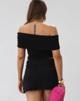 Knit top. Strapless neckline. Front wire. Ruched bodice. Back cut out. Partially lined. black deep v top. black off the should top. going out top.