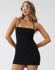 Knit top. Adjustable halter tie neck. Side slit. Unlined. Black top. Black halter tie top. Minimal top. Going out top. Side slit