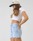 Relaxed high rise vintage shorts. Button fly closure. Distressed. Unlined. No stretch. light wash denim shorts. frayed shorts. mid to high rise shorts