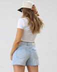 Relaxed high rise vintage shorts. Button fly closure. Distressed. Unlined. No stretch. light wash denim shorts. frayed shorts. mid to high rise shorts