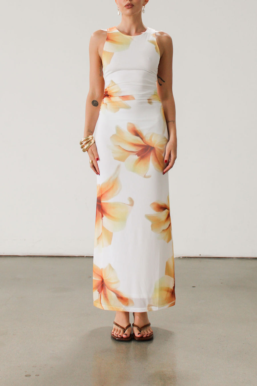 Floral knit mesh maxi dress. Sleeveless. Ruched sides. Fully lined.