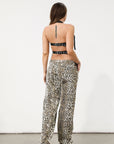 Printed jeans. Button and zipper fly. Five pocket construction. Unlined. cheetah pants. cheetah jeans. leopard jeans. leopard pants