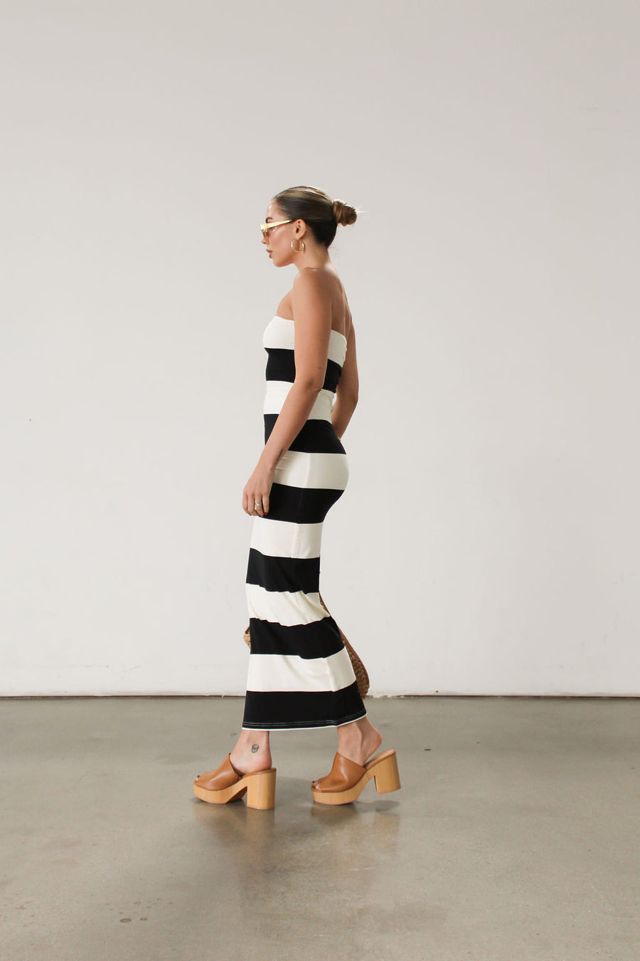 Striped knit maxi dress. Strapless elastic neckline. Fully lined. Stretchy, black and ivory, horizontal stripe maxi dress