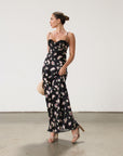 Floral printed satin maxi dress. Adjustable straps. Lace trim. Underwire cups. Side zipper closure. Back clasp closure. Unlined.
