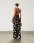 Floral printed satin maxi dress. Adjustable straps. Lace trim. Underwire cups. Side zipper closure. Back clasp closure. Unlined.