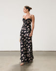 Floral printed satin maxi dress. Adjustable straps. Lace trim. Underwire cups. Side zipper closure. Back clasp closure. Unlined.