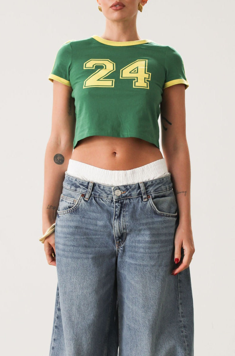 Knit crop tee. Short sleeves. Unlined. Green with yellow trim. Varsity number 24.