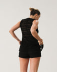Knit lace sleeveless top. Front button down closure. Unlined.