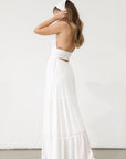 Crinkle woven maxi dress. Adjustable halter tie neck. Elastic smocked waist. Elastic back. Back cut out. Fully lined. White maxi dress. White halter neck dress. Summer dress. dress to wear on vacation. flowy dress. deep v neck dress. European summer outfit