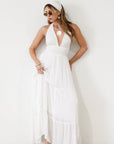 Crinkle woven maxi dress. Adjustable halter tie neck. Elastic smocked waist. Elastic back. Back cut out. Fully lined. White maxi dress. White halter neck dress. Summer dress. dress to wear on vacation. flowy dress. deep v neck dress. European summer outfit