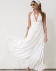 Crinkle woven maxi dress. Adjustable halter tie neck. Elastic smocked waist. Elastic back. Back cut out. Fully lined. White maxi dress. White halter neck dress. Summer dress. dress to wear on vacation. flowy dress. deep v neck dress. European summer outfit