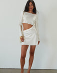 Satin dress. Long sleeves. Side cut out. Side zipper closure. Unlined. off white satin dress. off white mini dress. dress with cut out. cream satin mini dress. bride. bridal dress. engagement dress. bridal shower dress. wedding after party dress