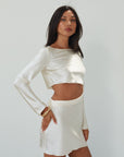 Satin dress. Long sleeves. Side cut out. Side zipper closure. Unlined. off white satin dress. off white mini dress. dress with cut out. cream satin mini dress. bride. bridal dress. engagement dress. bridal shower dress. wedding after party dress