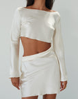 Satin dress. Long sleeves. Side cut out. Side zipper closure. Unlined. off white satin dress. off white mini dress. dress with cut out. cream satin mini dress. bride. bridal dress. engagement dress. bridal shower dress. wedding after party dress