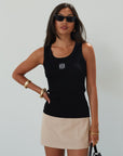 Woven mini skort. Side hook and eye and zipper closures. Back pockets. Shorts lining. mini skort. beige skort. tan skort. summer skort.