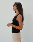 Woven mini skort. Side hook and eye and zipper closures. Back pockets. Shorts lining. mini skort. beige skort. tan skort. summer skort.