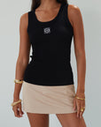Woven mini skort. Side hook and eye and zipper closures. Back pockets. Shorts lining. mini skort. beige skort. tan skort. summer skort.