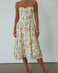 Floral printed woven midi dress. Adjustable straps. Underwire cups. Side pockets. Back hook and eye and zipper closures. Fully lined. floral midi dress. summer dress. summer midi dress.