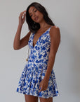 Printed woven dress. Adjustable cross rods back straps with tie closure. Back hook and eye and zipper closures. Fully lined. blue and white floral mini dress. summer dress. greece inspired dress. garden party dress. wedding guest dress.
