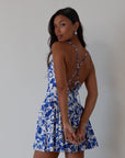 Printed woven dress. Adjustable cross rods back straps with tie closure. Back hook and eye and zipper closures. Fully lined. blue and white floral mini dress. summer dress. greece inspired dress. garden party dress. wedding guest dress.