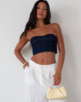 Denim tube top. Strapless neckline. Inner rubber grip lining. Back hook and eye and zipper closures. Fully lined. summer top. going out top