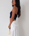 Denim tube top. Strapless neckline. Inner rubber grip lining. Back hook and eye and zipper closures. Fully lined. summer top. going out top