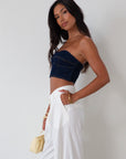 Denim tube top. Strapless neckline. Inner rubber grip lining. Back hook and eye and zipper closures. Fully lined. summer top. going out top