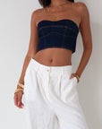 Denim tube top. Strapless neckline. Inner rubber grip lining. Back hook and eye and zipper closures. Fully lined. summer top. going out top