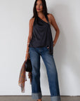 Denim wide leg jeans. Button and zipper fly. Five pocket construction. Cuffed hems. Unlined. dark wash denim jeans. fold up denim jeans. fold up pants. fold up jeans.
