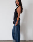 Denim wide leg jeans. Button and zipper fly. Five pocket construction. Cuffed hems. Unlined. dark wash denim jeans. fold up denim jeans. fold up pants. fold up jeans.