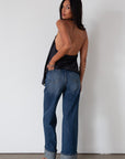 Denim wide leg jeans. Button and zipper fly. Five pocket construction. Cuffed hems. Unlined. dark wash denim jeans. fold up denim jeans. fold up pants. fold up jeans.