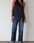 Denim wide leg jeans. Button and zipper fly. Five pocket construction. Cuffed hems. Unlined. dark wash denim jeans. fold up denim jeans. fold up pants. fold up jeans.