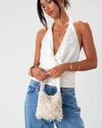Small beaded bag. Fixed top strap. Top snap button closure. Fully lined. 