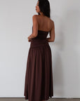Knit maxi dress. Strapless elastic neckline. Inner rubber grip lining. Ruched slides. Partially lined. brown maxi dress. brown starpless maxi dress. summer dress. wedding guest dress