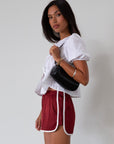 Satin shorts. Elastic waist. Side pockets. Unlined. cute track shorts. fashion track short. red shorts. red track shorts.