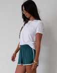 Satin shorts. Elastic waist. Side pockets. Unlined. cute track shorts. fashion track short. green shorts. green track shorts.