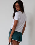 Satin shorts. Elastic waist. Side pockets. Unlined. cute track shorts. fashion track short. green shorts. green track shorts.