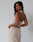Chiffon crop top. Halter neckline with back button closures. Ruffle trimmed deep v-neckline. Side hook and eye and zipper closures. Partially lined. ruffle top. ruffle tank top. nude top. coquette top