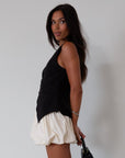 Woven skirt. Back hook and eye and zipper closures. Elastic bubble hem. Fully lined. cream bubble skirt. cream bubble mini skirt