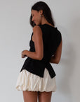 Woven skirt. Back hook and eye and zipper closures. Elastic bubble hem. Fully lined. cream bubble skirt. cream bubble mini skirt