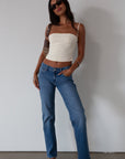 Woven crop top. Fixed straps. Back hook and eye and zipper closures. Fully lined. cream tank top. cream crop top tank. summer top. going out top