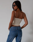 Woven crop top. Fixed straps. Back hook and eye and zipper closures. Fully lined. cream tank top. cream crop top tank. summer top. going out top