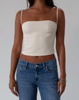 Woven crop top. Fixed straps. Back hook and eye and zipper closures. Fully lined. cream tank top. cream crop top tank. summer top. going out top