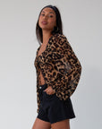 Denim shorts. Button and zipper fly. Five pocket construction. Raw hem. Unlined. black denim shorts