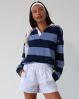 Striped knit crop top. Collar neckline. Long sleeves. Oversized fit. Unlined. polo long sleeve. lounge top. dress down top