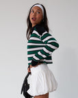 Striped ribbed knit crop top. Collar neckline. Long sleeves. Raw hem. Unlined. green and white stripe sweater long sleeve top