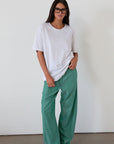green Striped woven pants. Elastic waistband with drawstring closure. Side pockets. Unlined. fall transition outfit. lounge outfit. cute casual outfit