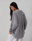 Striped woven shirt. Collar neckline. Long sleeves with button closure. Front button down closures. Front pocket. Unlined. 