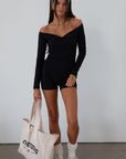 Knit romper. Long sleeves. Surplice neckline. Unlined. black romper. black off the shoulder romper. on the go cute outfit.